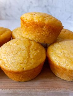 several yellow muffins stacked on top of each other