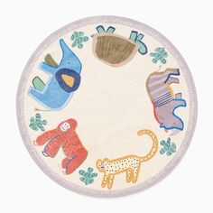 a round rug with animals and letters on the bottom in various colors, shapes and sizes