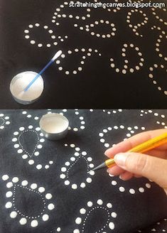 someone is drawing on a table with white dots and a yellow pencil in front of it