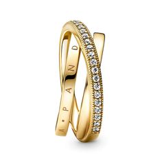 Go for linear layers with the Crossover Pavé Triple Band Ring. Hand-finished in 14K gold-plated metal, this ring features three bands, with one diagonally overlapping the other two. One inner band is embossed with the Pandora logo, the other inner band is polished and the outer band features clear cubic zirconia pavé framed by micro-beading. Inspired by the mesmerising structure of the solar system, this ring brings sleek, structural sophistication to any look. Need Bracelets, Future Jewelry, Pandora Logo, Triple Band Ring, Pandora Gold, Pandora Heart, Women Jewellery, Pave Band, Pandora Rings