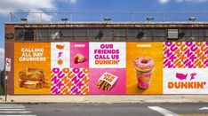 an advertisement for dunkin'donuts is painted on the side of a building