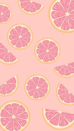 pink grapefruit slices on a light pink background