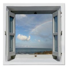 an open window overlooking the ocean with blue sky and water in the background is shown