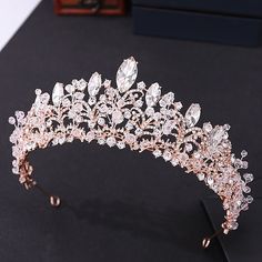 a tiara is shown on a black surface