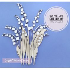 a bunch of white flowers sitting on top of a blue background with the words svg ploter cut lily of the valley