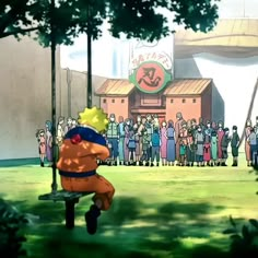 a large group of people standing in front of a building with a cartoon character sitting on a bench