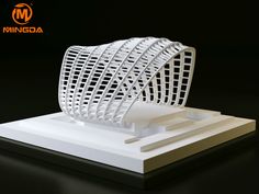 a white sculpture sitting on top of a table