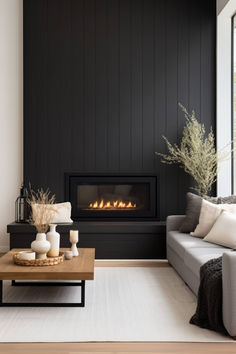 a living room with a couch, coffee table and fire place in the fireplace area