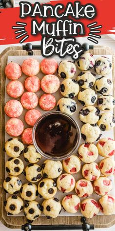 a tray filled with cookies and muffins on top of a table