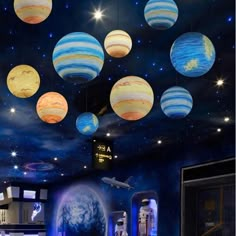 the ceiling is decorated with planets and stars