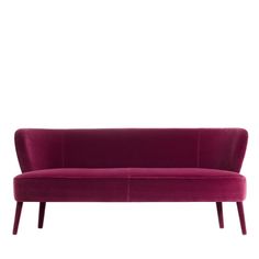 a purple couch sitting on top of a white floor