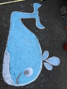 a drawing of a blue whale on the ground