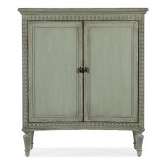 an antique style cabinet with two doors