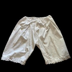 Antique 1900s Edwardian Pantaloons Bloomers White Cotton with laced trim These exquisite antique bloomers feature a beautiful cotton lace trim with flowers. The waist band has elastic. The crotch is closed. These bloomers are in excellent vintage condition.  ✂--✂----------- measurements lying flat. Waist 31cm-12.25'' non stretched / maximal stretched 62cm-24.5'' Hips 80cm-31.5'' Length 58cm- 22.75"  Crotch 39cm-16.25'' If you have any questions or need additional photos or measurements, please let me know. Vintage Cotton Bottoms With Elastic Waistband, Vintage White Lace Bottoms, White Vintage Lace Bottoms, White Lace Vintage Bottoms, Daywear Cotton Bloomers With Ruffles, Spring Cotton Bottoms With Lace Work, Cotton Bloomers With Ruffles For Daywear, Summer Cotton Bottoms With Lace Work, White Lace Trim Bottoms For Daywear