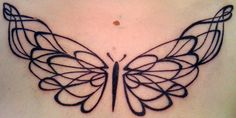 a black butterfly tattoo on the chest