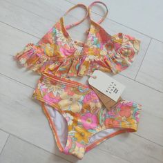 Billabong Ain't She A Beaut Ruffle Bikini Set Multi Colors Be Ready For A Day Of Making A Splash At The Beach In The Billabong Kids Aint She A Beaut Ruffle Tri Set Triangle Top With Ruffle Trim All-Over Print Adjustable Ring And Slider Straps Pull-Over Design Medium Rear Coverage Branding Embroidered On Back Of Bottom New Retail $69.95 Sz 7 Or 8 Girls Smoke & Pet Free Home Vans Volcom Billabong Roxy Quiksilver Brixton Reef Mauiandsons Ripcurl Hang Ten Hurley Gap O'neill Columbia Biker Shorts Lul Cute Summer Shirts, Billabong Girls, Swim Party, Billabong Swim, Long Sleeve Swimsuit, Spring Vacation, Hang Ten, Tank Girl, Swimsuit Set