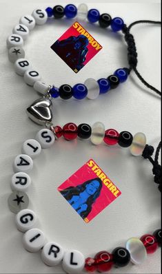 two bracelets that have different colored beads on them, one with an image of superman