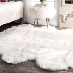 a white rug on the floor in a room