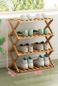 three tier bamboo shoe rack with 3 pairs of shoes on top and two rows of shoes below