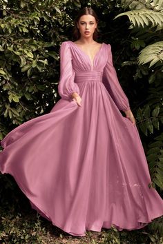 Cinderella Divine CD0192 This dreamy chiffon gown features a layered a-line skirt gathered at the waist. Sheer long sleeves drape the arms up to the gathered deep v-neckline bodice and ruched waistband. The back has a mid-opening allowing for bra strap coverage.