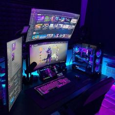 two computer monitors sitting next to each other on top of a desk with keyboard and mouse