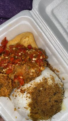 a plastic container filled with food on top of a table