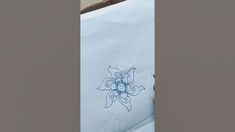 a white sheet with blue designs on it