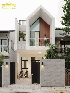 the front entrance to a modern house with black doors