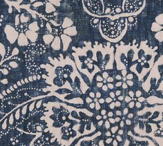 a blue and white floral design on fabric