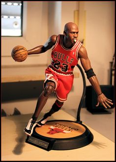 a figurine of a basketball player holding a ball