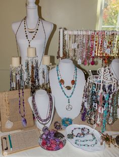 several necklaces and bracelets are on display