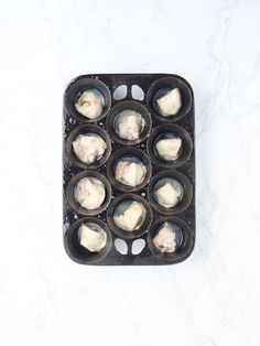 an image of some food in a muffin tin on the table with white background