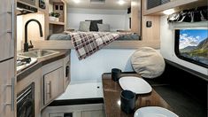 the interior of an rv is clean and ready to be used as a camper