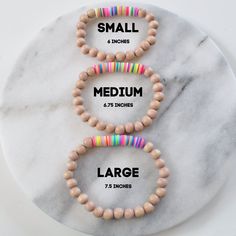 A fun trendy beaded stretch bracelet for 2021? This might be the only thing to go right this year! ;) Three Sizes: Small (6"), Medium (6.75"), or Large (7.5") Four Colors: Cream, Whitewash, Blush or Natural 8mm Taiwanese wood beads 8mm soft vinyl Heishi beads (random patterns vary) clear stretch cord this listing is for 1 (one) bracelet Braclets Diy, Heishi Jewelry, Random Patterns, Bracelet Size Chart, Handmade Crystal Jewelry, Wood Bead Bracelet, Beaded Jewlery, Clay Bracelet, Diy Bracelet Designs