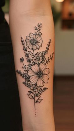 a black and white flower tattoo on the leg