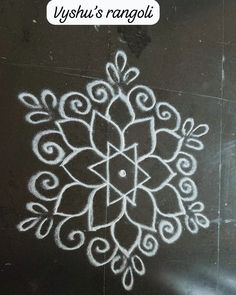 a white drawing on the ground with words written in it and an image of a flower