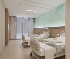 an empty hospital room with white beds and medical equipment on the tables in front of a large painting