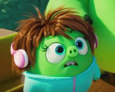 the angry birds character is wearing headphones and looking at something in front of him