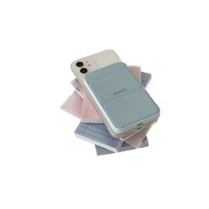 a cell phone sitting on top of a pile of papers with the back cover open