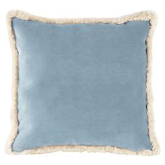 a blue and white pillow with fur trim