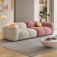 a modern living room with pink and white furniture