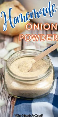 homemade onion powder in a glass jar with a wooden spoon next to it on a blue and white checkered table cloth