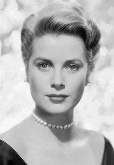 an old black and white photo of a woman with pearls on her neck, wearing a pearl necklace