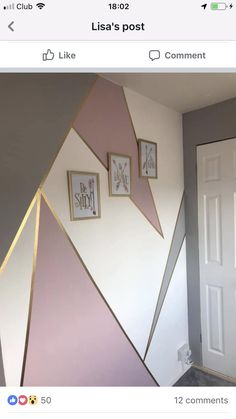 a room that has some pictures on the wall and is decorated with pink, white and gold