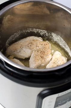 the chicken is being cooked in the pot on the stove top, ready to be cooked