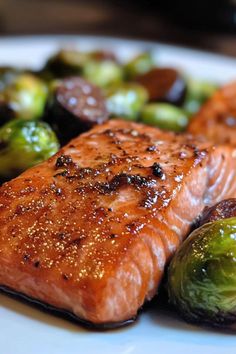 salmon and brussel sprouts on a white plate