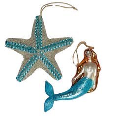 an ornament shaped like a mermaid and a starfish