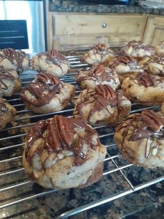 chocolate and pecan cookies cooling on the oven rack, ready to go into the oven