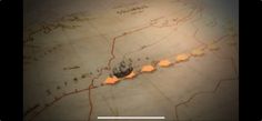 an image of a map that is blurry and has orange arrows pointing to different locations