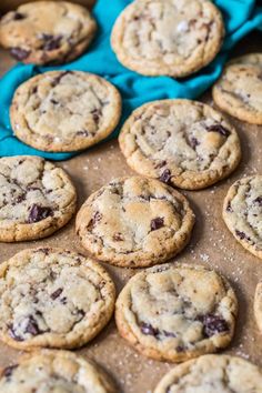 chocolate chip cookies sitting on top of a cookie sheet